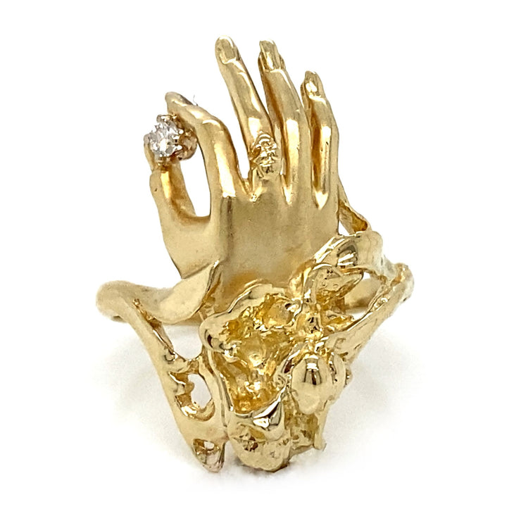 Hand Holding Diamond Ring