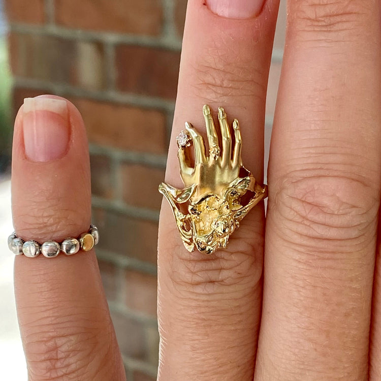 Hand Holding Diamond Ring
